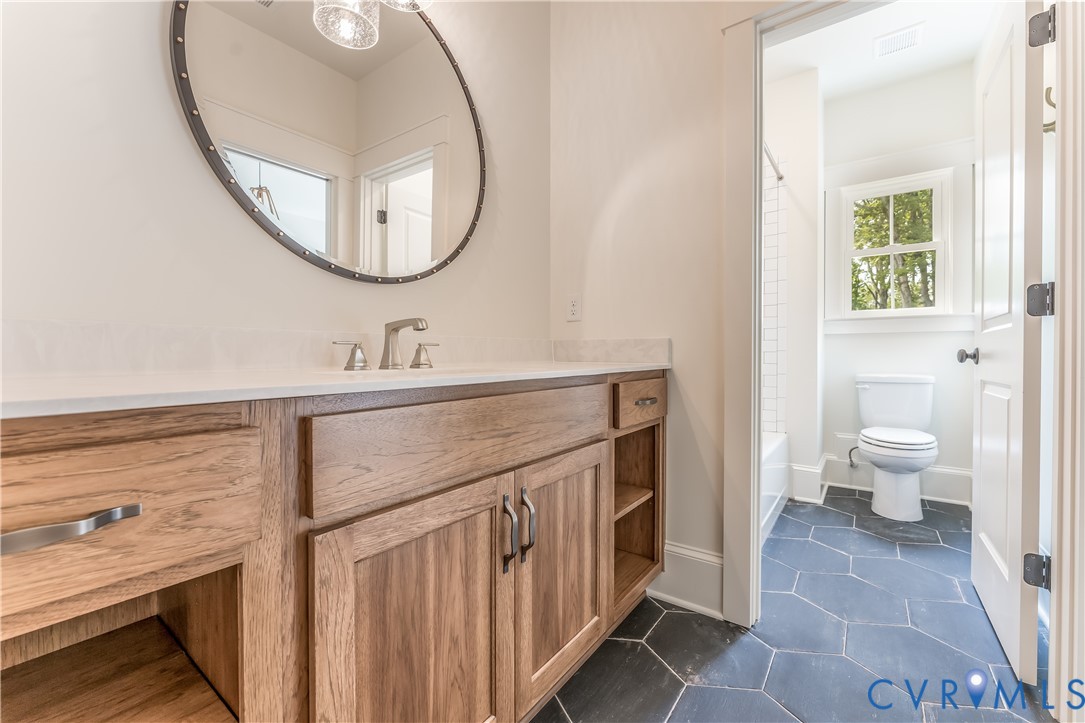 2707 North Otterdale Road Midlothian, VA 23113 - Photo 17 of 21 a bathroom with a sink and a mirror