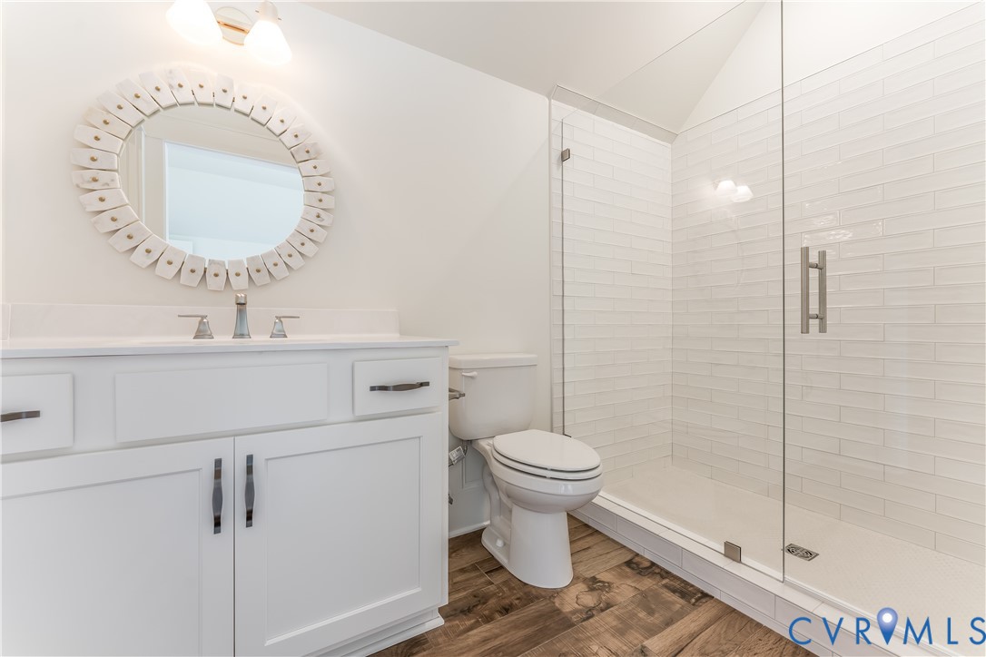 2707 North Otterdale Road Midlothian, VA 23113 - Photo 18 of 21 a bathroom with a sink toilet a mirror and shower