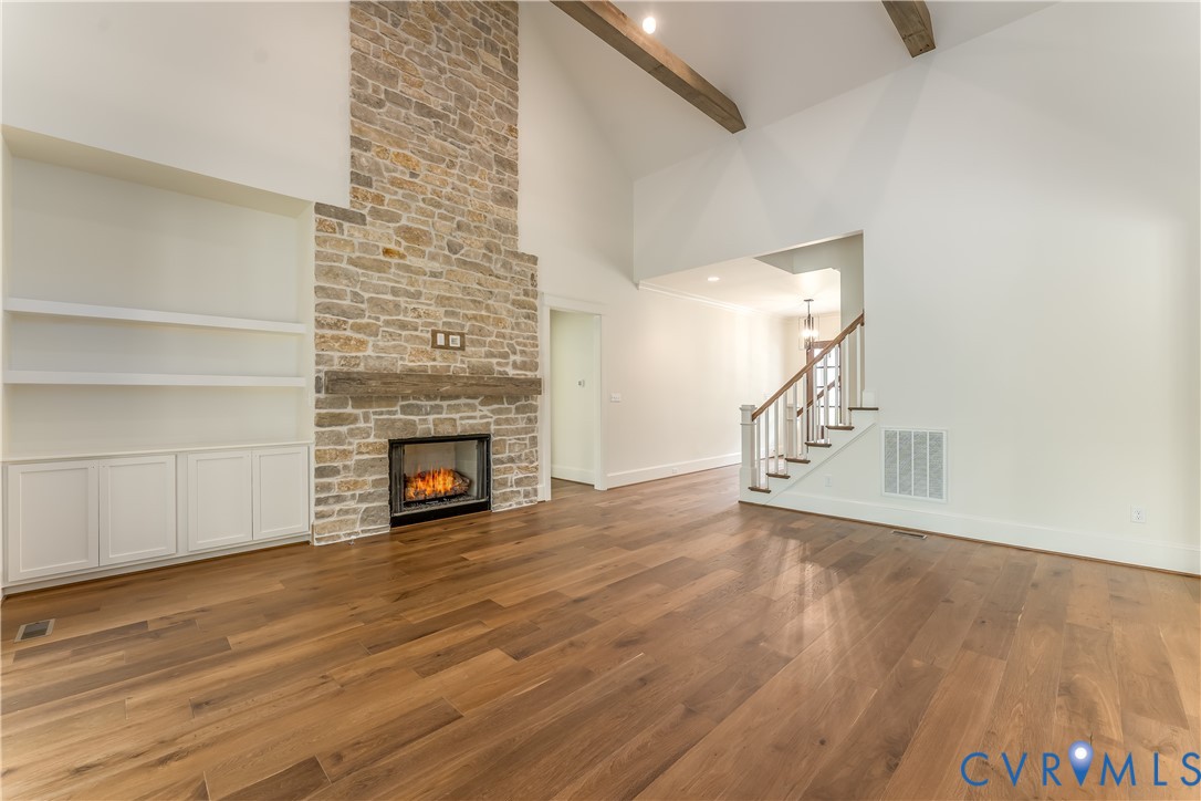 2707 North Otterdale Road Midlothian, VA 23113 - Photo 7 of 21 a view of empty room with wooden floor and fireplace