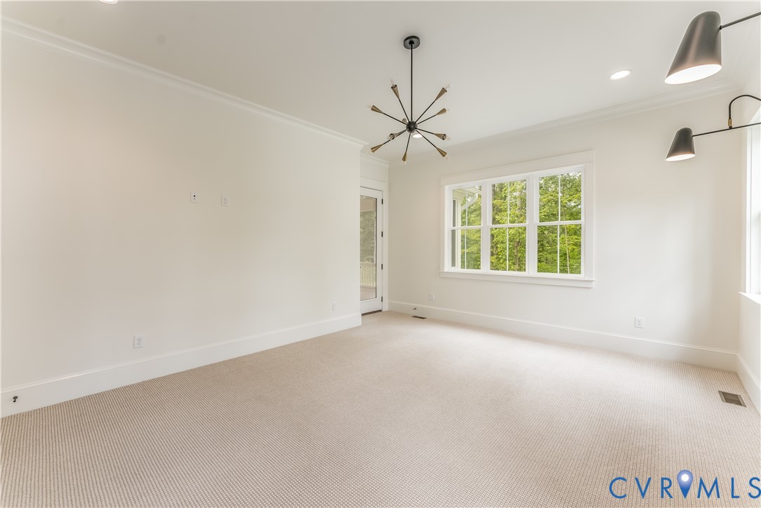 2707 North Otterdale Road Midlothian, VA 23113 - Photo 8 of 21 an empty room with windows and ceiling fan