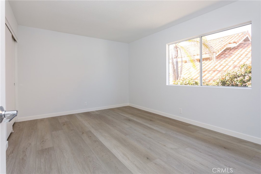 29672 Teracina Laguna Niguel, CA 92677 - Photo 22 of 35 an empty room with wooden floor and windows