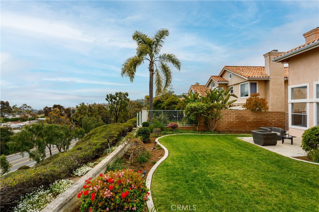 29672 Teracina Laguna Niguel, CA 92677 - Photo 31 of 35 a view of a garden with a building in the background