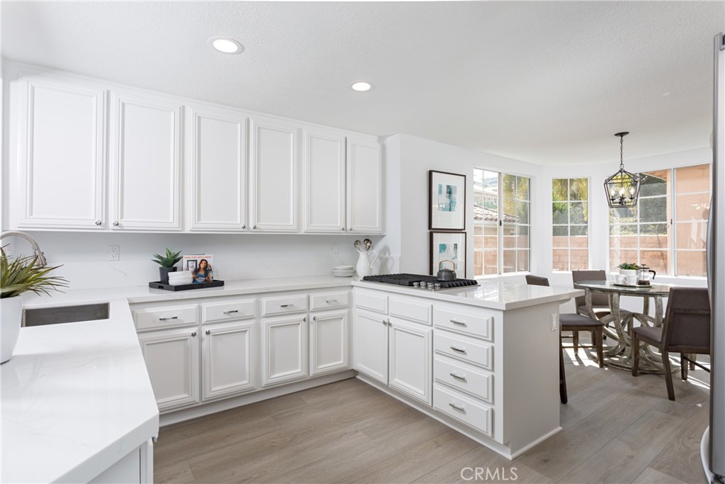 29672 Teracina Laguna Niguel, CA 92677 - Photo 8 of 35 a kitchen with a sink stove and cabinets