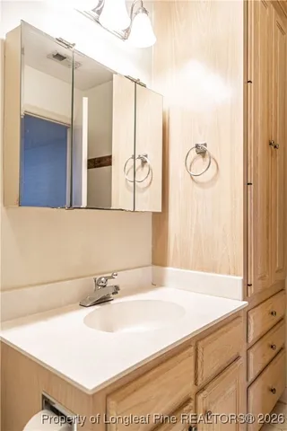 a bathroom with a bathtub and a sink