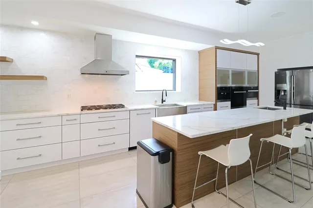 a view of a hallway with a big room and balcony