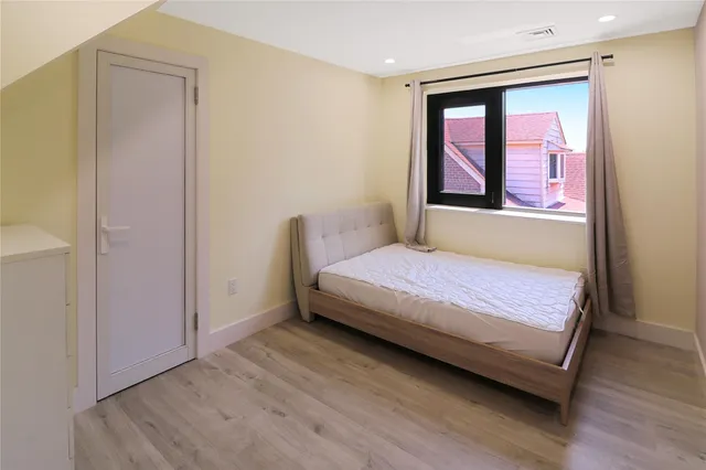 a view of entryway with wooden floor and stairs