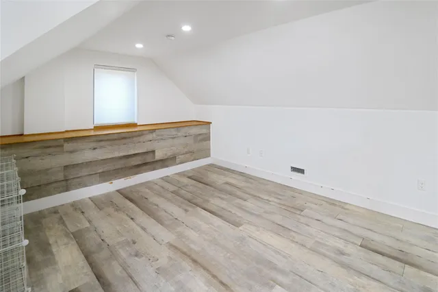 a front view of a house with a yard table and chairs