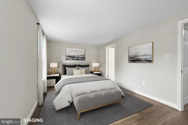 a bed room with a bed and a night stand