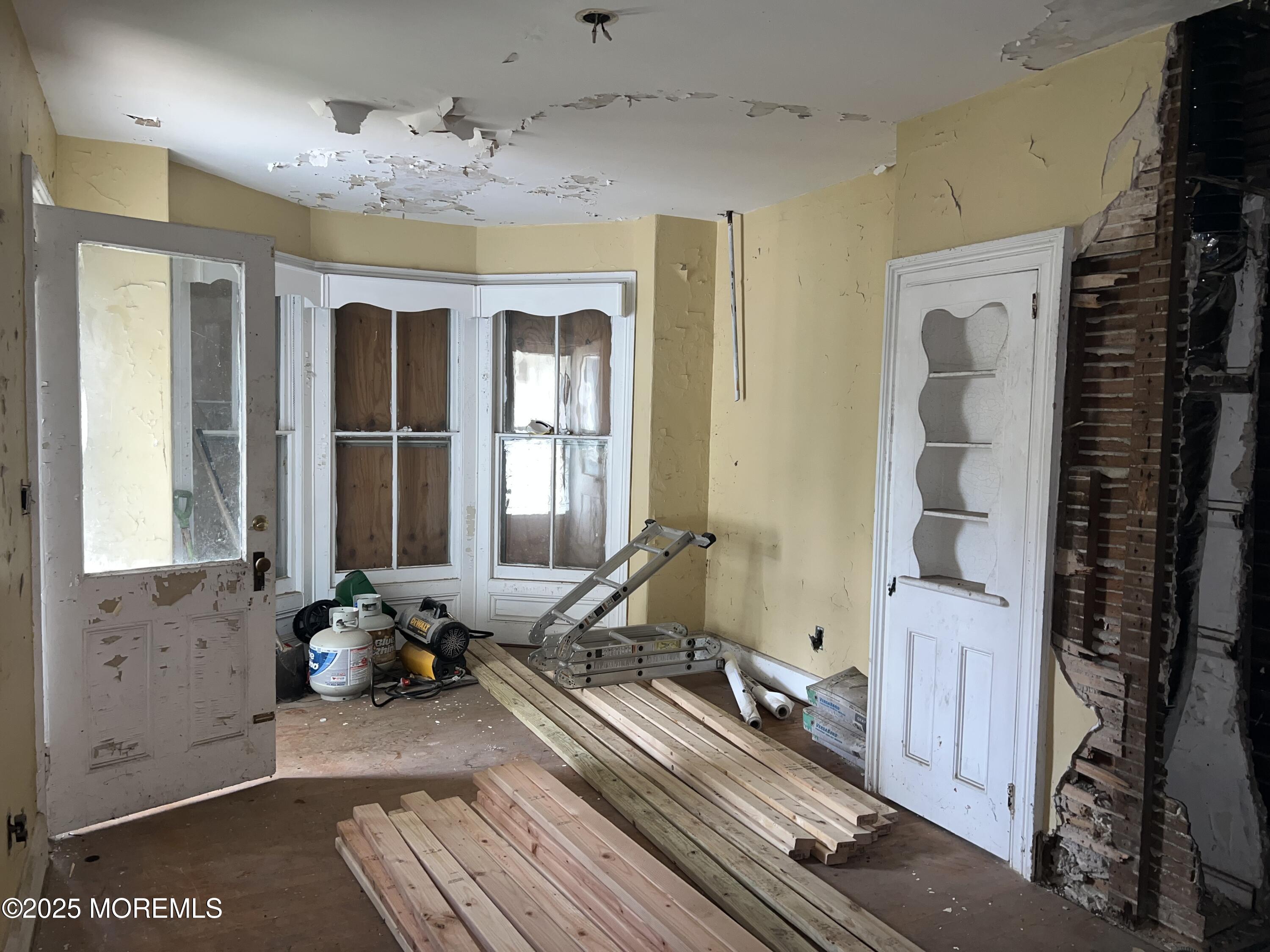 258 Jackson Street Matawan, NJ 07747 - Photo 6 of 16 a room with gym equipment and windows