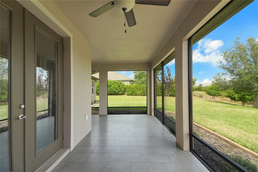 6008 Apex Way Lady Lake, FL 32159 - Photo 41 of 93 a view of a porch with furniture and garden