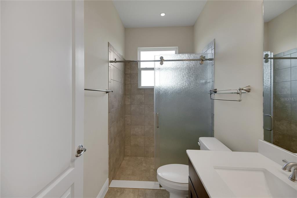 6008 Apex Way Lady Lake, FL 32159 - Photo 63 of 93 a bathroom with a toilet and a shower