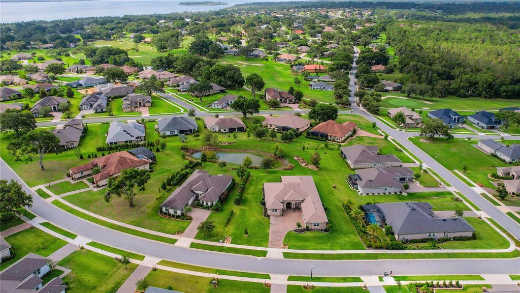 6008 Apex Way Lady Lake, FL 32159 - Photo 72 of 93 an aerial view of residential houses with outdoor space