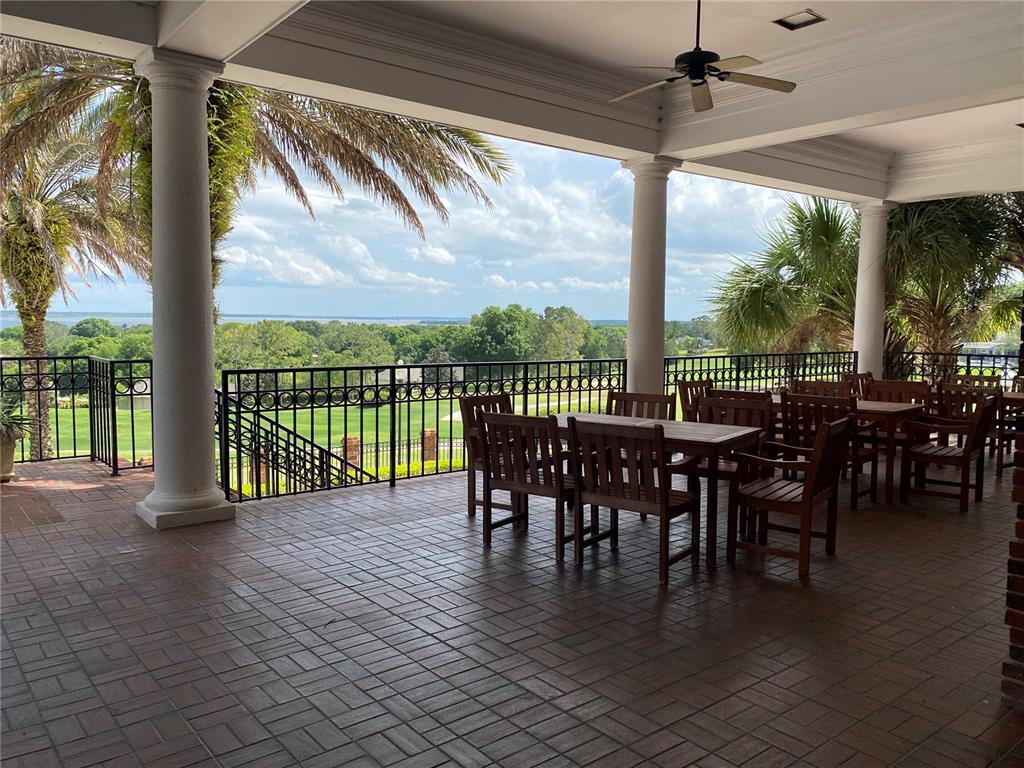 6008 Apex Way Lady Lake, FL 32159 - Photo 88 of 93 a view of a patio with a table chairs and a table