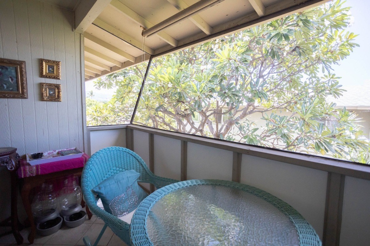 74-5618 Palani Road, Unit C2 Kailua-Kona, HI 96740 - Photo 7 of 8 a view of a porch with furniture and a window