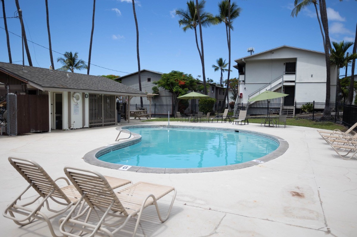 74-5618 Palani Road, Unit C2 Kailua-Kona, HI 96740 - Photo 8 of 8 a view of a house with swimming pool