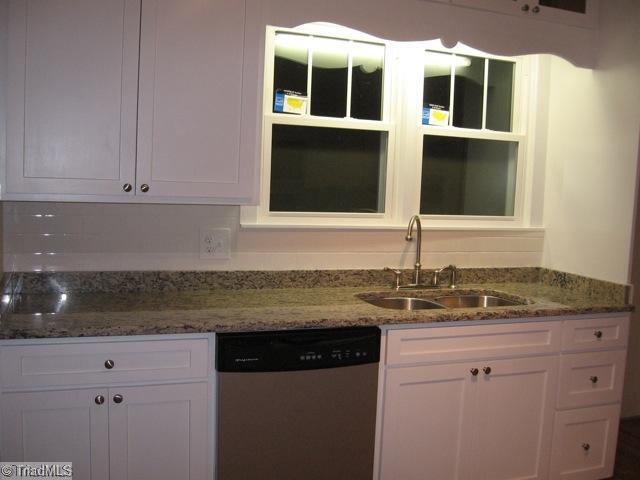 512 Ray Street High Point, NC 27262 - Photo 7 of 13 Exterior Front. Renovated kitchen with granite counter tops & new appliances. Laundry room just off kitchen.