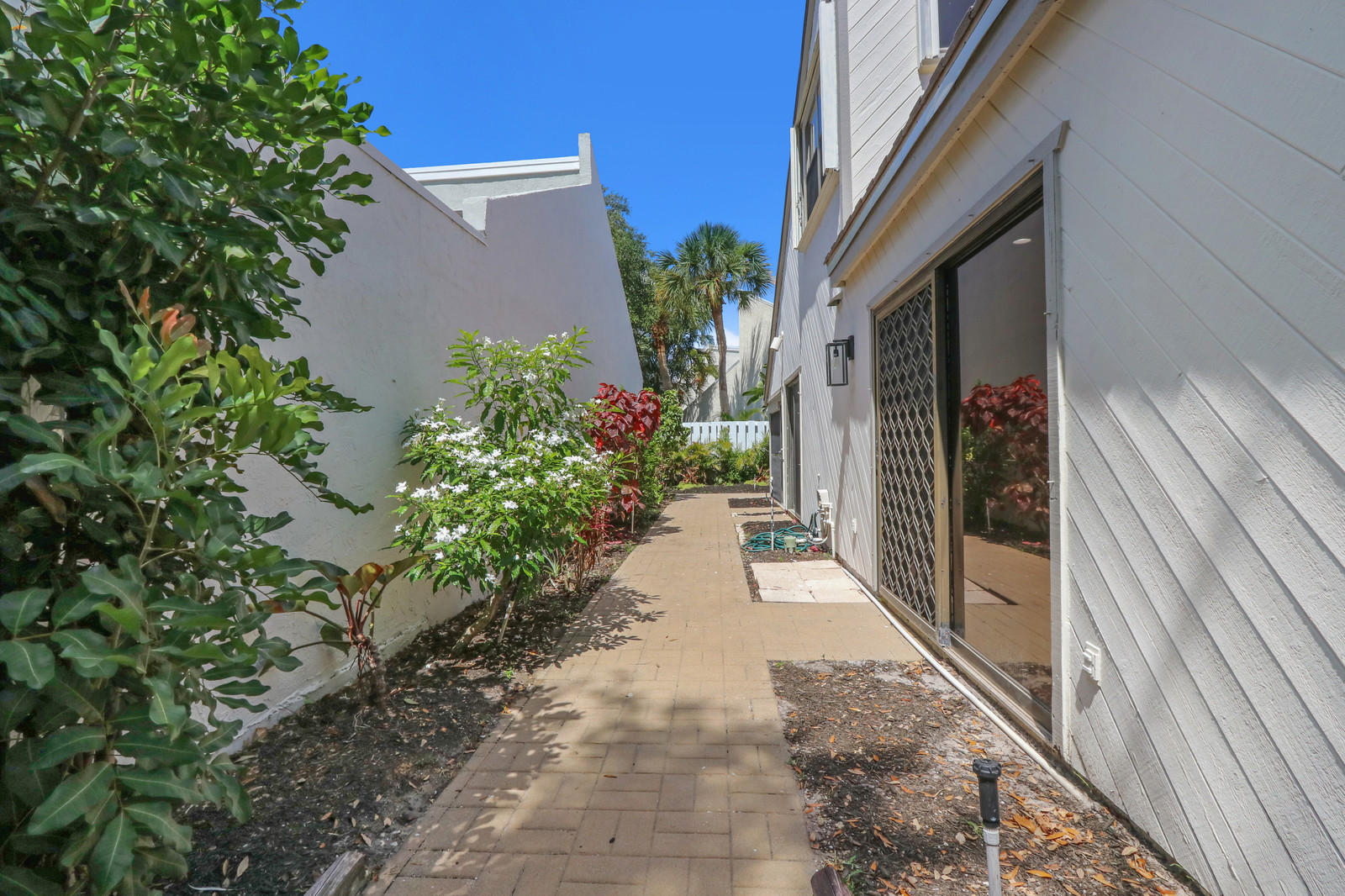 17029 Traverse Circle Jupiter, FL 33477 - Photo 23 of 30 Paved Side Yard