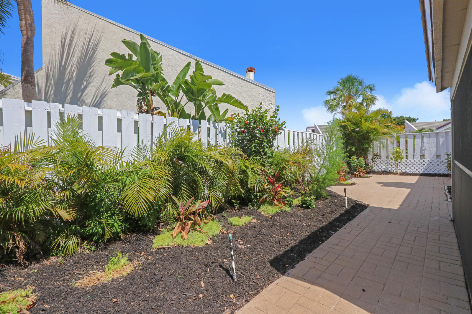 17029 Traverse Circle Jupiter, FL 33477 - Photo 26 of 30 Landscaped Rear Patio