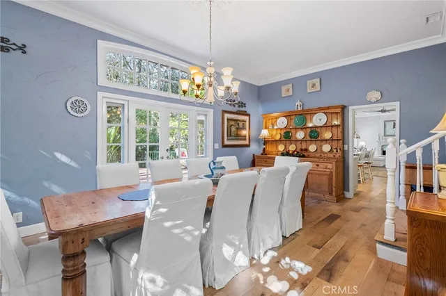 a living room with furniture a large window and a fireplace
