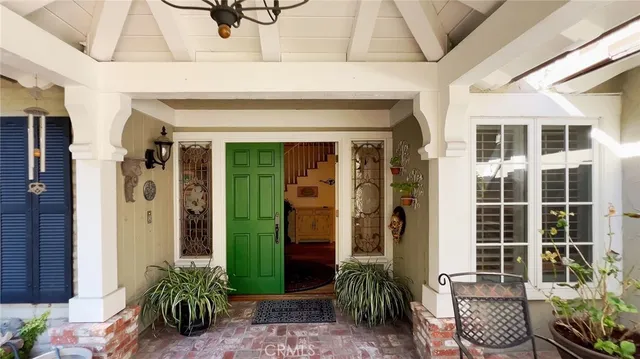 a outdoor living area with a table and chairs