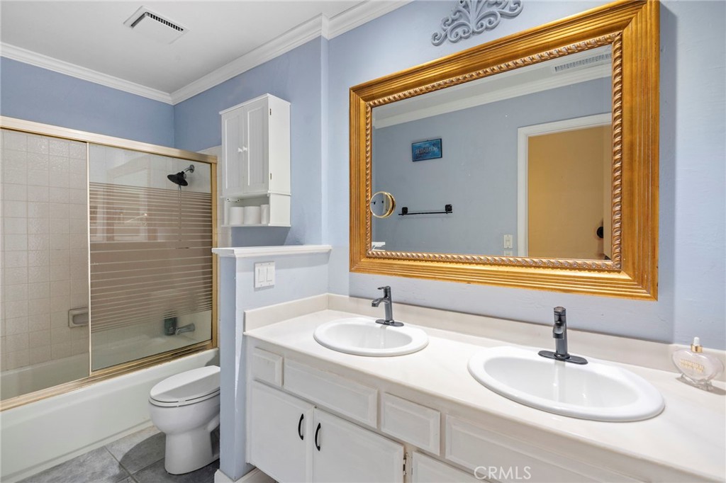 24945 Valley Rim Terrace Lake Forest, CA 92630 - Photo 24 of 52 a bathroom with a sink a toilet and shower