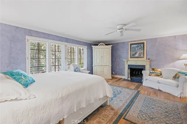 a bedroom with a bed dresser and a window