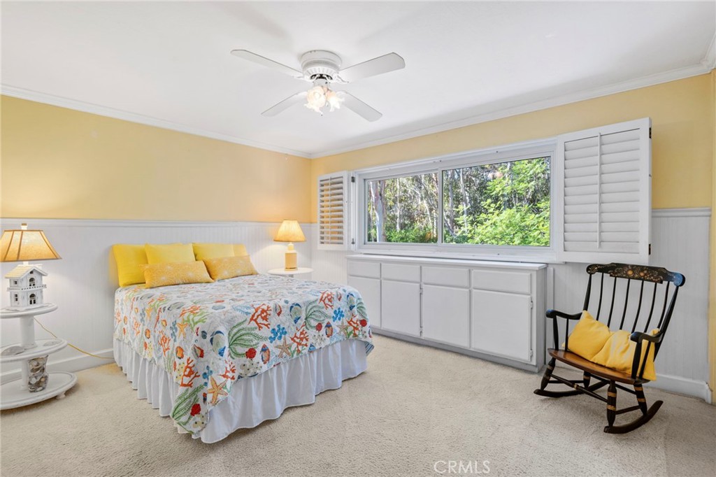 24945 Valley Rim Terrace Lake Forest, CA 92630 - Photo 29 of 52 a bedroom with a bed and a chandelier