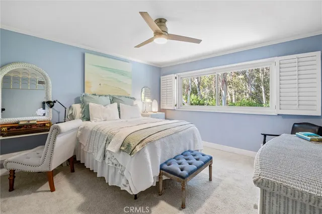a bedroom with furniture and a book shelf