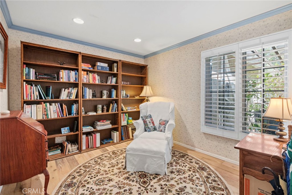 24945 Valley Rim Terrace Lake Forest, CA 92630 - Photo 31 of 52 a bedroom with furniture and a book shelf