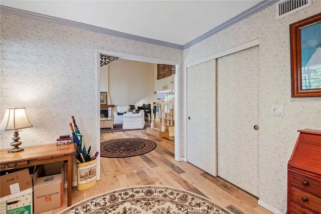a bathroom with a granite countertop toilet a sink and a mirror