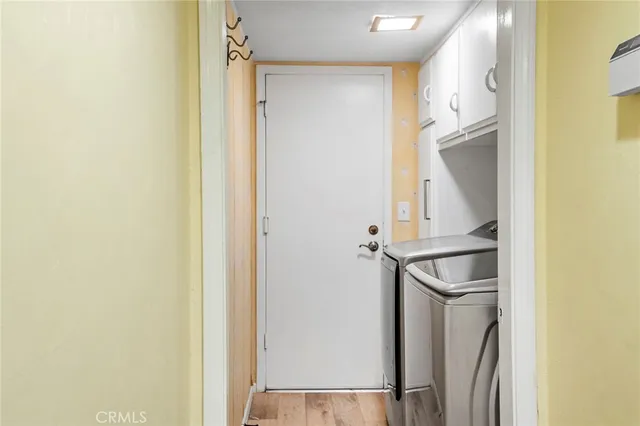 a view of balcony with two chairs and a potted plant