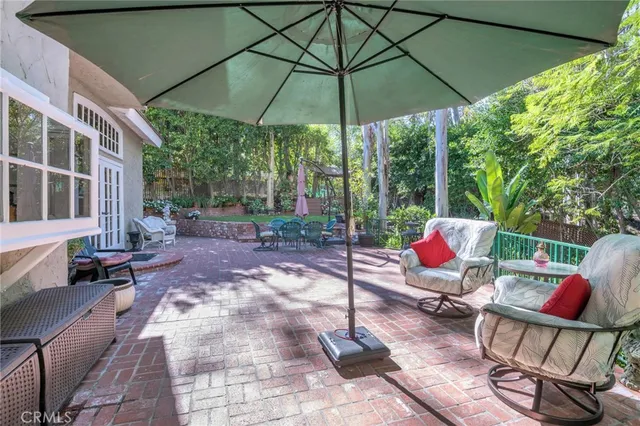 a view of a backyard with large trees