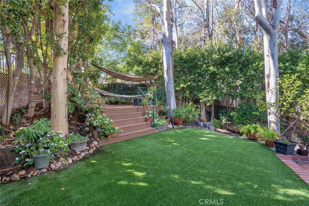 24945 Valley Rim Terrace Lake Forest, CA 92630 - Photo 42 of 52 a view of a garden with large trees