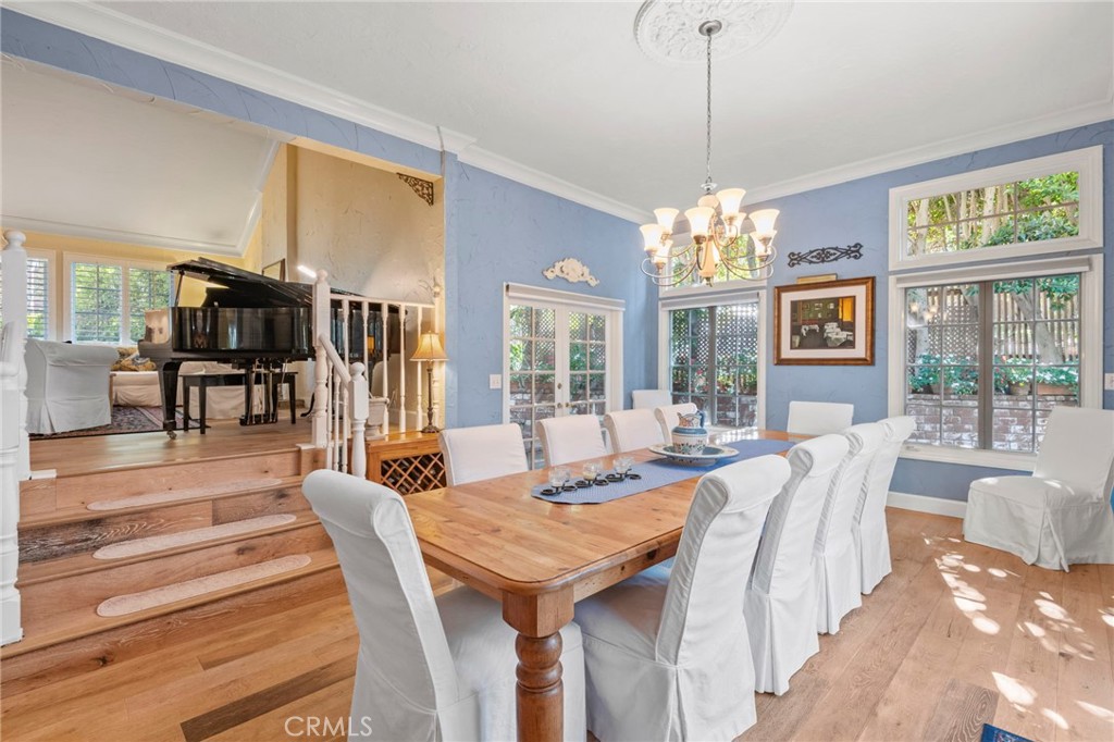 24945 Valley Rim Terrace Lake Forest, CA 92630 - Photo 8 of 52 a dining room with wooden floor chandelier