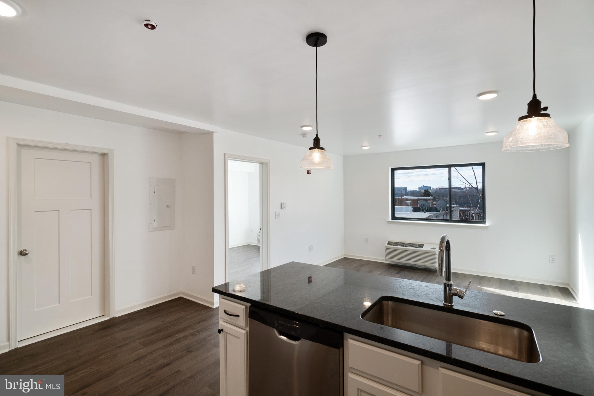 5420 Ridge Avenue, Unit 206 Philadelphia, PA 19128 - Photo 3 of 10 a bathroom with a sink and a mirror
