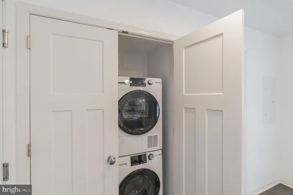 a view of a hallway with washer and dryer