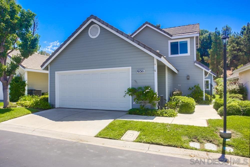 10458 Rancho Carmel Drive San Diego, CA 92128 - Photo 1 of 60 a front view of a house with a yard and garage