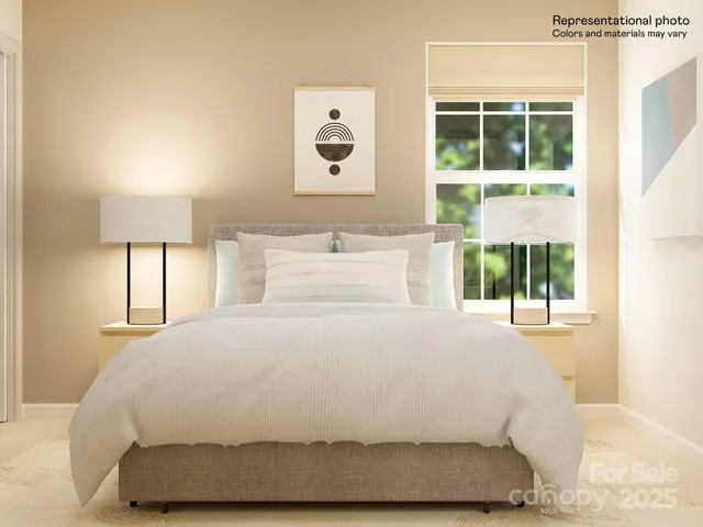 a living room with a bed and furniture