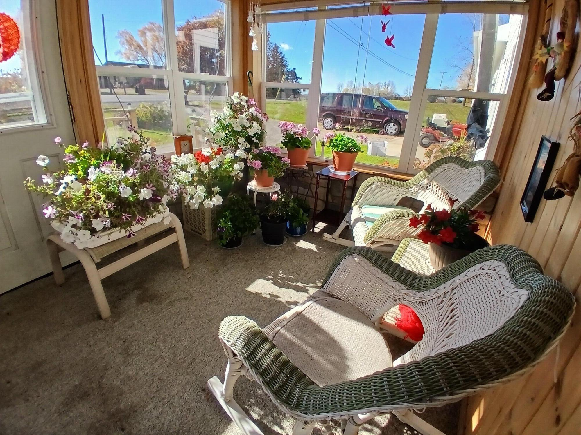 2489 10 Mile Road Northwest Sparta, MI 49345 - Photo 31 of 52 home front porch fall flowers brought in