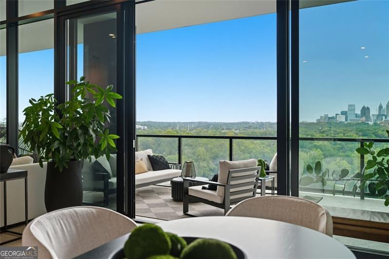 2425 Peachtree Road, Unit 1504 Atlanta, GA 30305 - Photo 11 of 66 a balcony with furniture and a potted plant