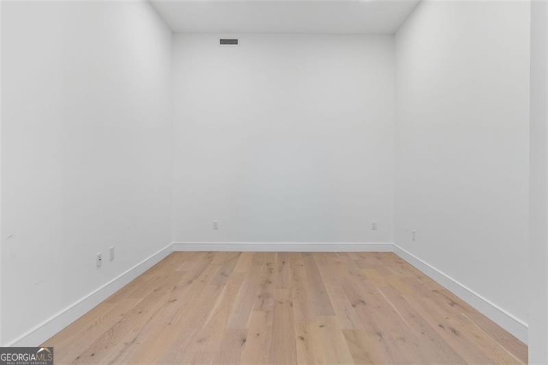 2425 Peachtree Road, Unit 1504 Atlanta, GA 30305 - Photo 13 of 66 a view of room with wooden floor