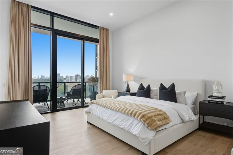 2425 Peachtree Road, Unit 1504 Atlanta, GA 30305 - Photo 17 of 66 a bedroom with a large bed and a large window