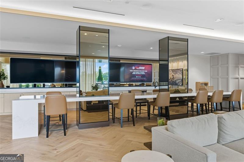 2425 Peachtree Road, Unit 1504 Atlanta, GA 30305 - Photo 38 of 66 a living room with a large window and a flat screen tv