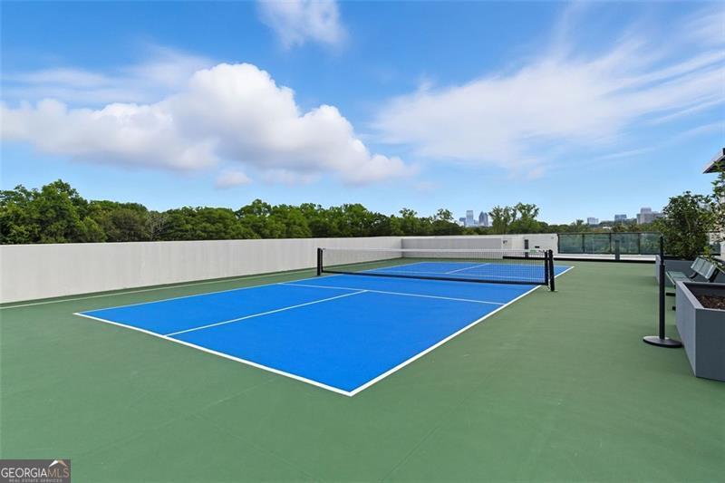 2425 Peachtree Road, Unit 1504 Atlanta, GA 30305 - Photo 43 of 66 a view of swimming pool with outdoor seating and barbeque in the back