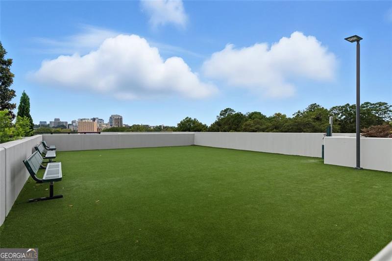 2425 Peachtree Road, Unit 1504 Atlanta, GA 30305 - Photo 45 of 66 a view of a golf course with a lake