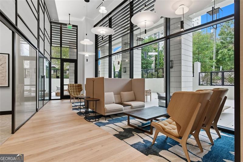 2425 Peachtree Road, Unit 1504 Atlanta, GA 30305 - Photo 51 of 66 a living room with furniture and a large window