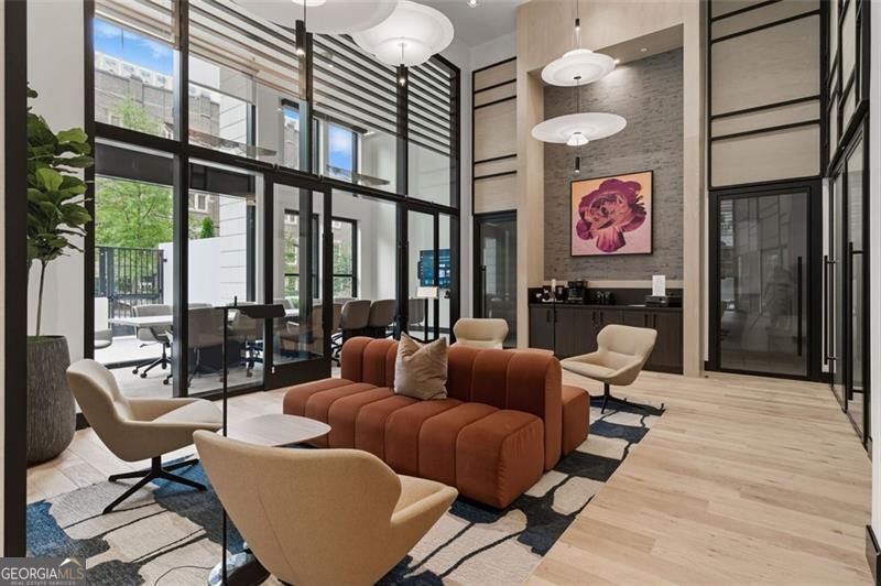 2425 Peachtree Road, Unit 1504 Atlanta, GA 30305 - Photo 52 of 66 a living room with furniture a floor to ceiling window and outdoor view