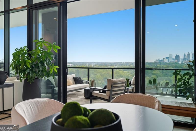 2425 Peachtree Road, Unit 1504 Atlanta, GA 30305 - Photo 59 of 66 a living room with furniture and a floor to ceiling window