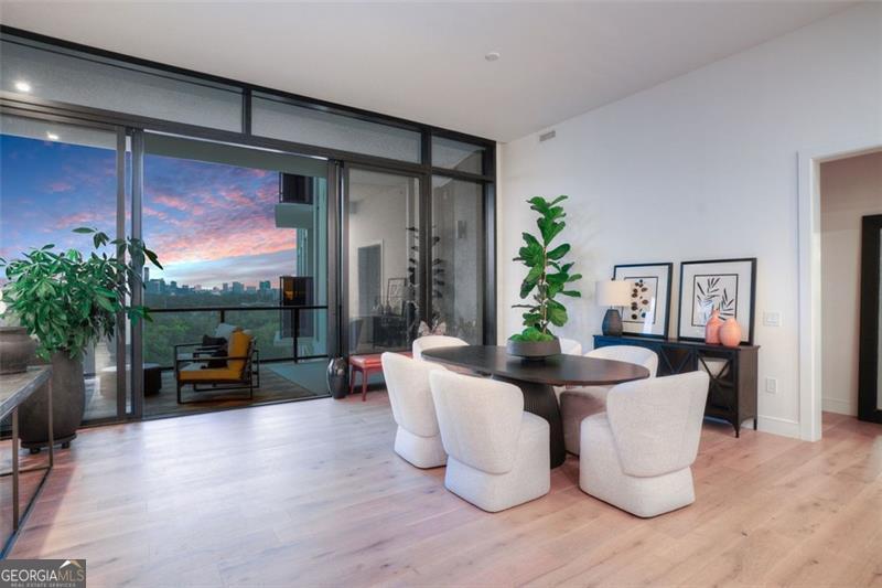 2425 Peachtree Road, Unit 1504 Atlanta, GA 30305 - Photo 63 of 66 a living room with fireplace furniture and a potted plant