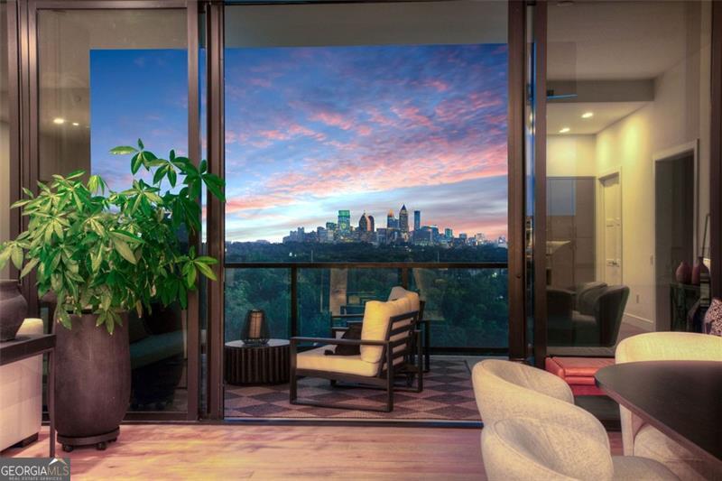 2425 Peachtree Road, Unit 1504 Atlanta, GA 30305 - Photo 64 of 66 a view of a balcony with furniture and a potted plant